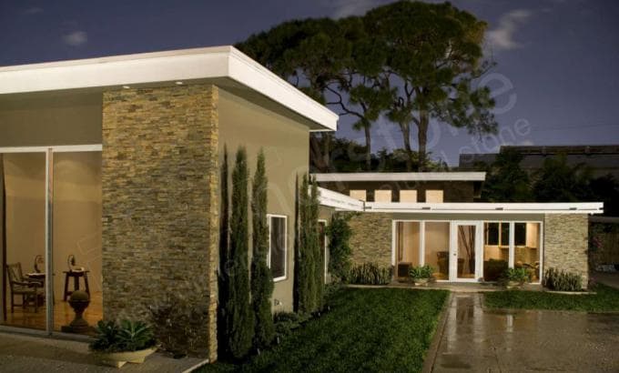 Norstone thin stone rock panels used as stone siding on the exterior of a mid century modern home in South Florida